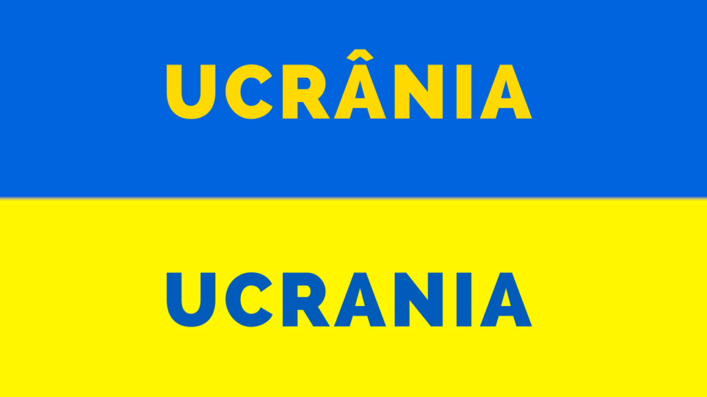 A imagem mostra uma bandeira azul e amarela, onde está escrito: 